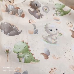 Bézs alapon barna-zöld baby dinó mintás pamutvászon