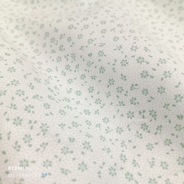 Fehér alapon apró zöld virág mintás pamutvászon