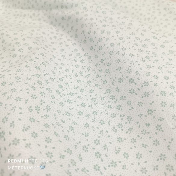 Fehér alapon apró zöld virág mintás pamutvászon